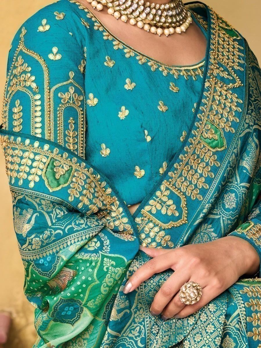 Teal embroidered saree with gold detailing, traditional Indian women's fashion
