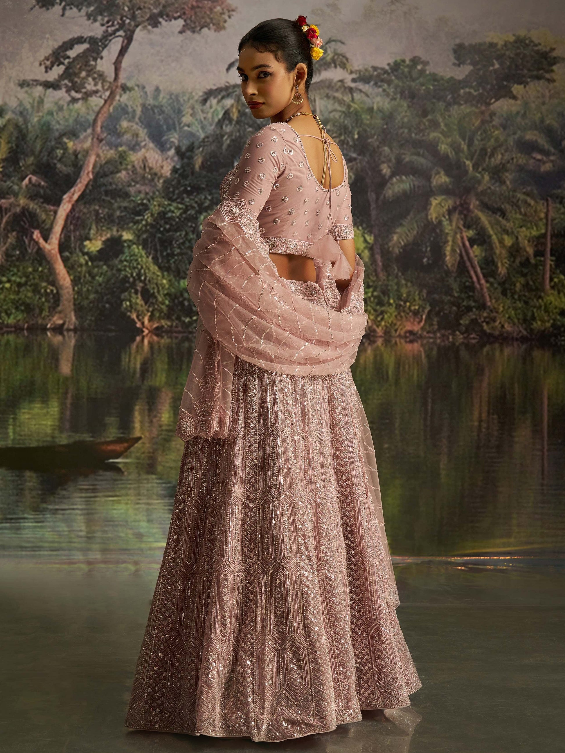 Dazzling Mauve Heavy Embroidered Net Event Wear Lehenga With Blouse