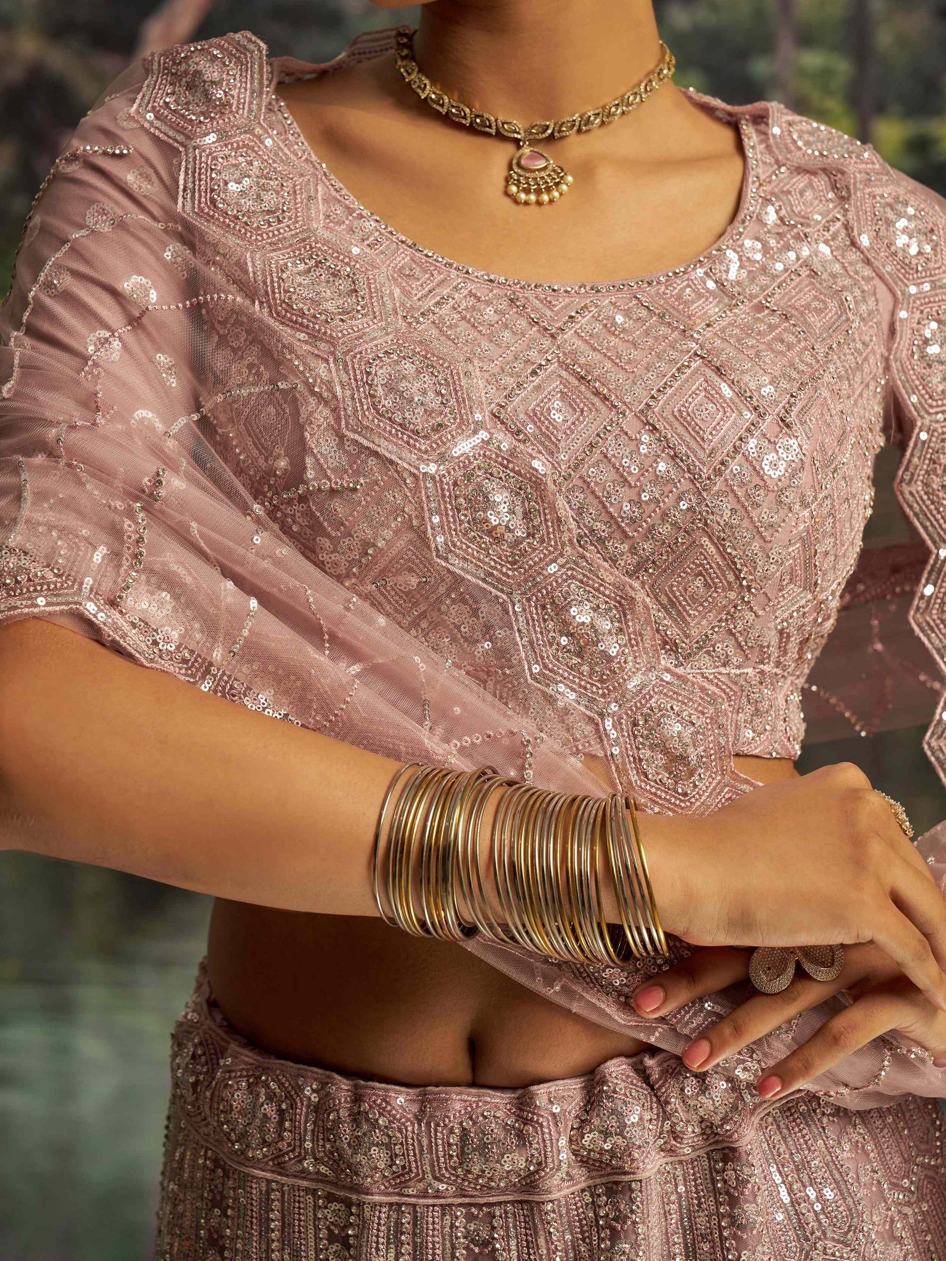 Dazzling Mauve Heavy Embroidered Net Event Wear Lehenga With Blouse