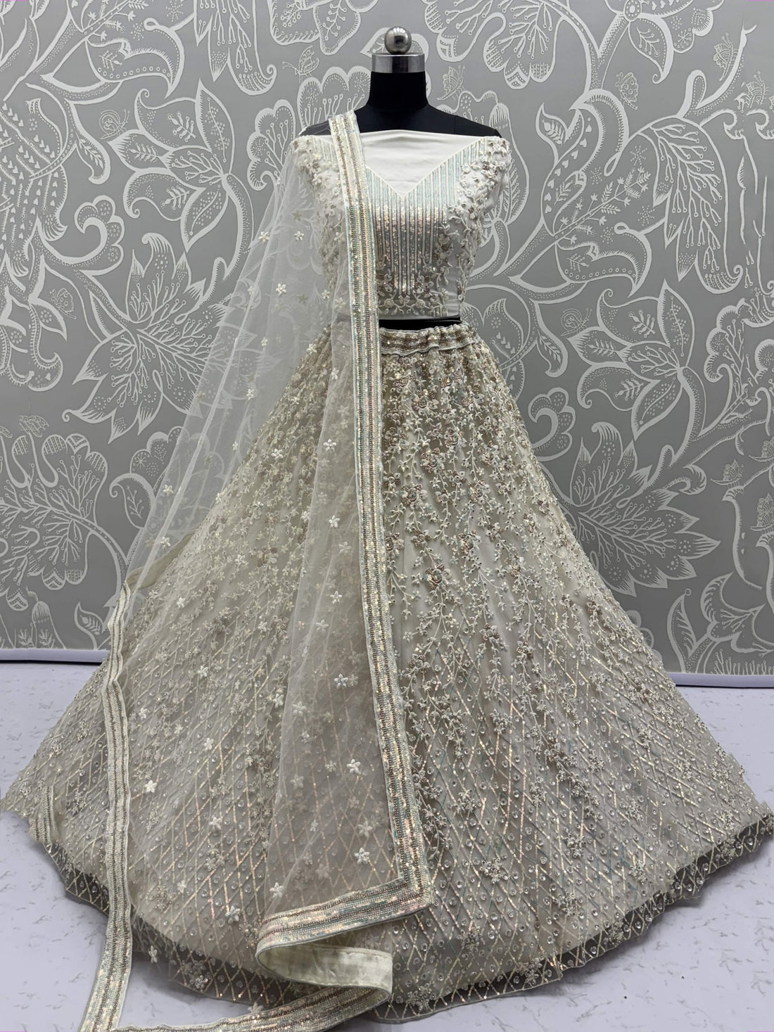 Dazzling Beige Zari Work Net Evening Wear Lehenga Choli With Dupatta