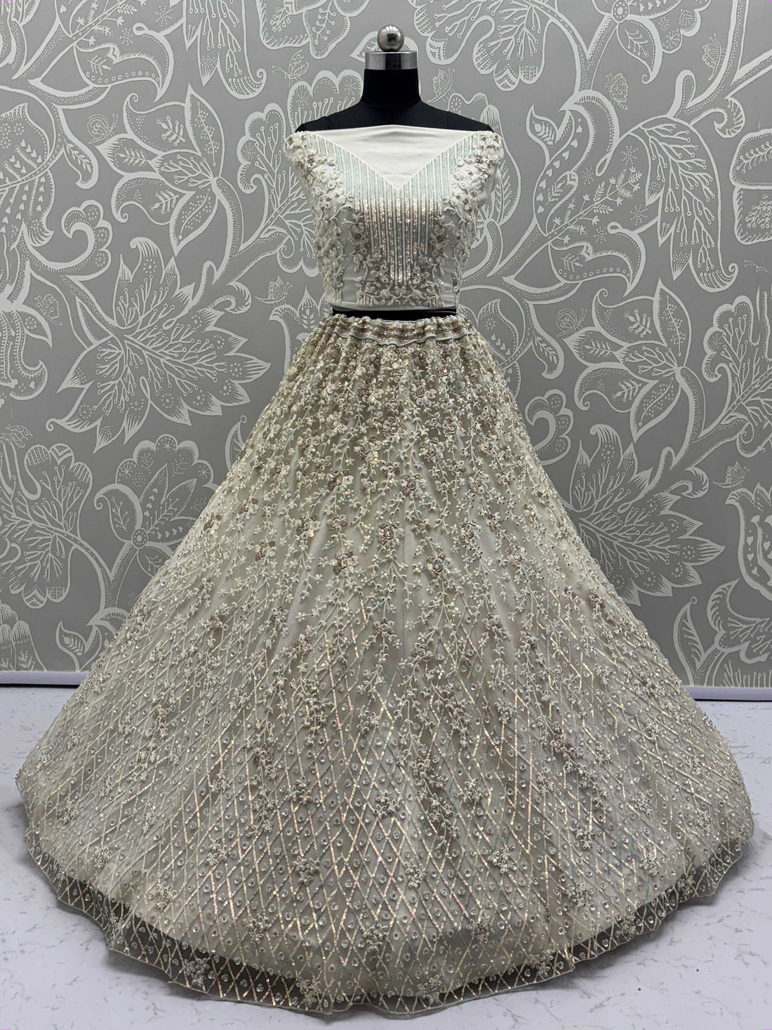 Dazzling Beige Zari Work Net Evening Wear Lehenga Choli With Dupatta