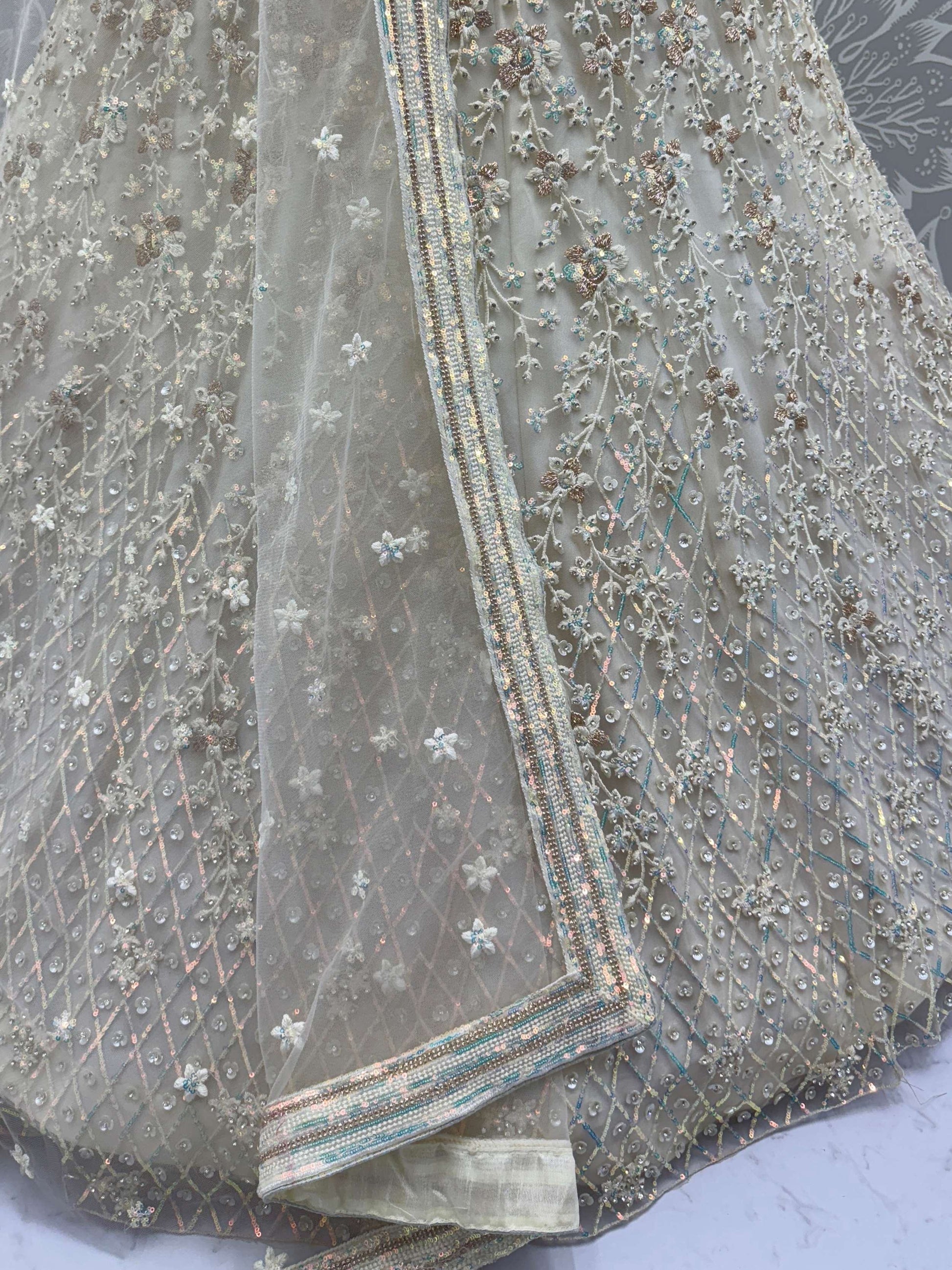 Dazzling Beige Zari Work Net Evening Wear Lehenga Choli With Dupatta