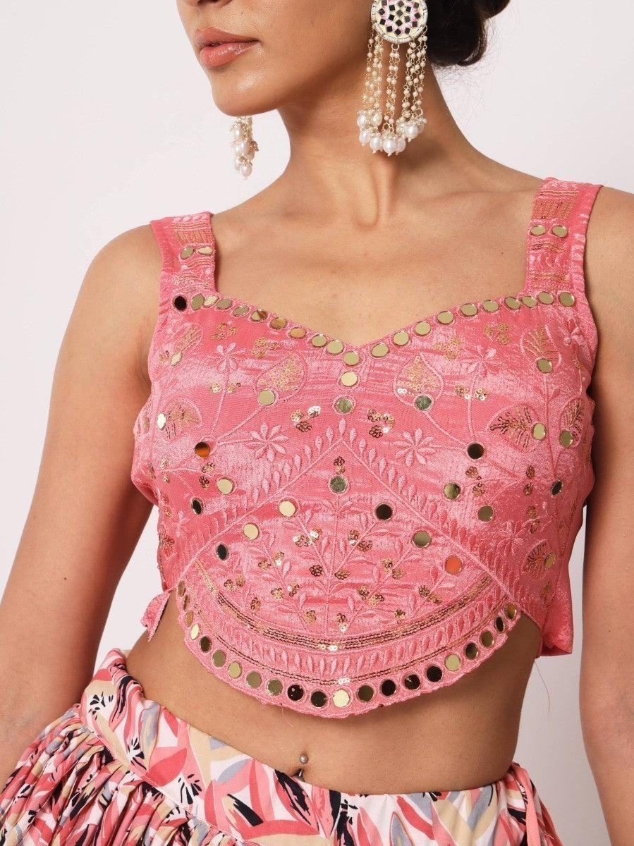 Pink embroidered crop top with mirror work and floral detailing, paired with printed skirt