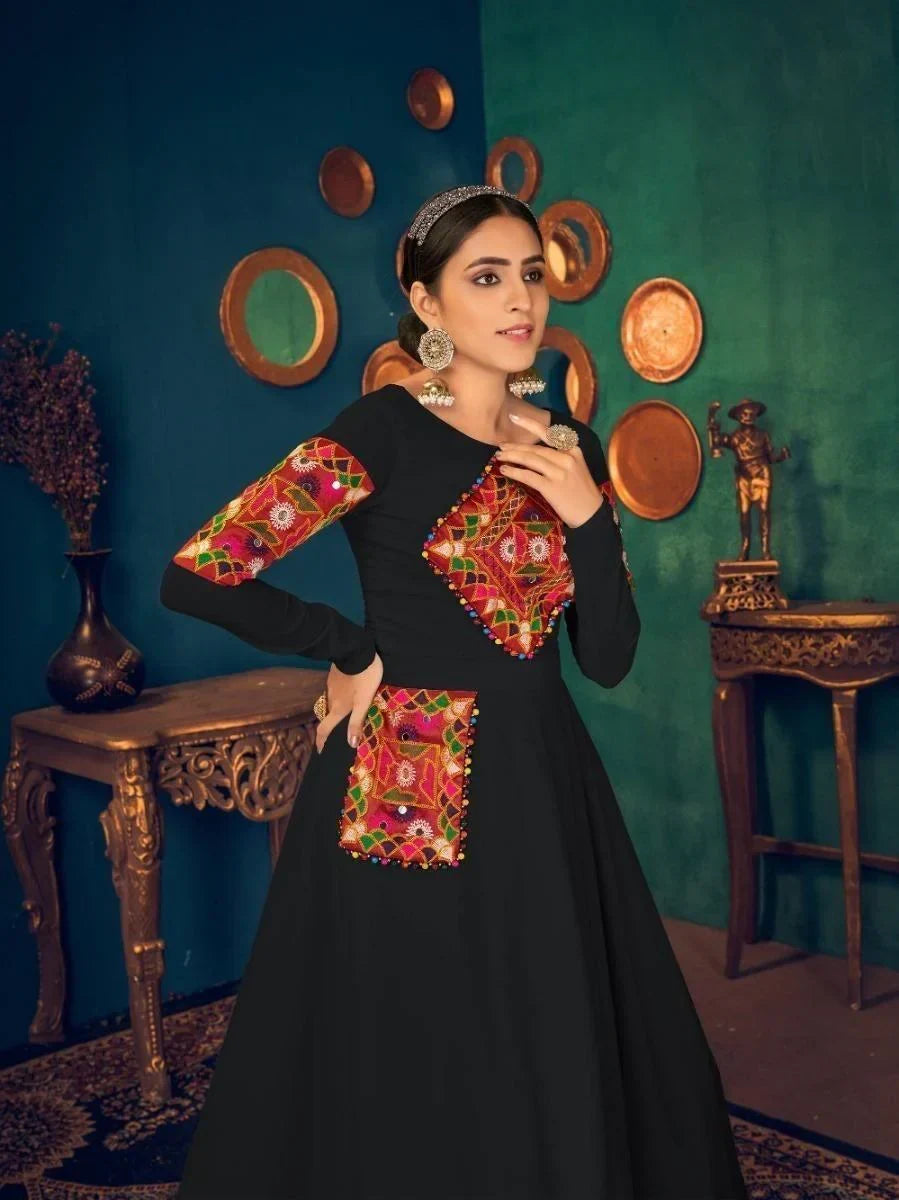 Black embroidered long dress with colorful geometric patterns, perfect for women's fashion trends.