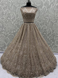 Enchanting Beige Embroidered Net Wedding Wear Lehenga Choli With Dupatta