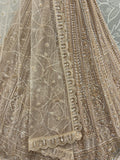 Enchanting Beige Embroidered Net Wedding Wear Lehenga Choli With Dupatta