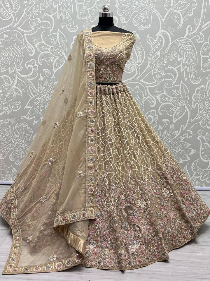 Enchanting Beige Multi Thread Work Net Reception Wear Lehenga Choli