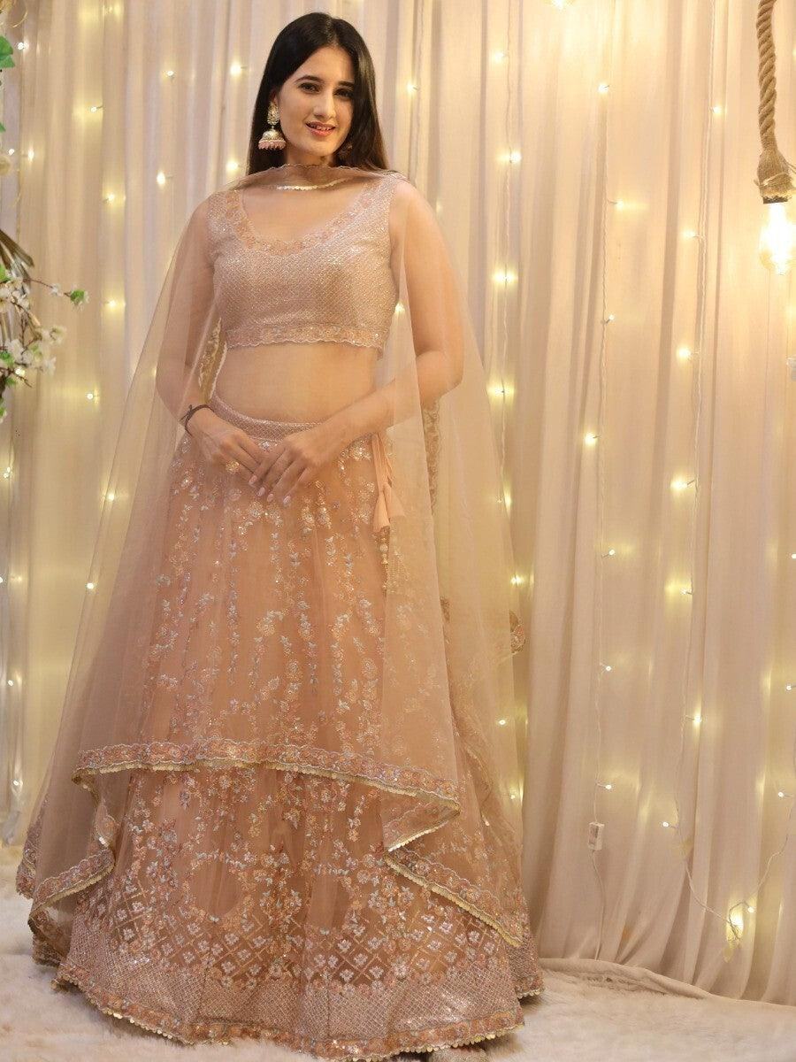 Enticing Peach Sequins Net Wedding Wear Lehenga Choli With Dupatta