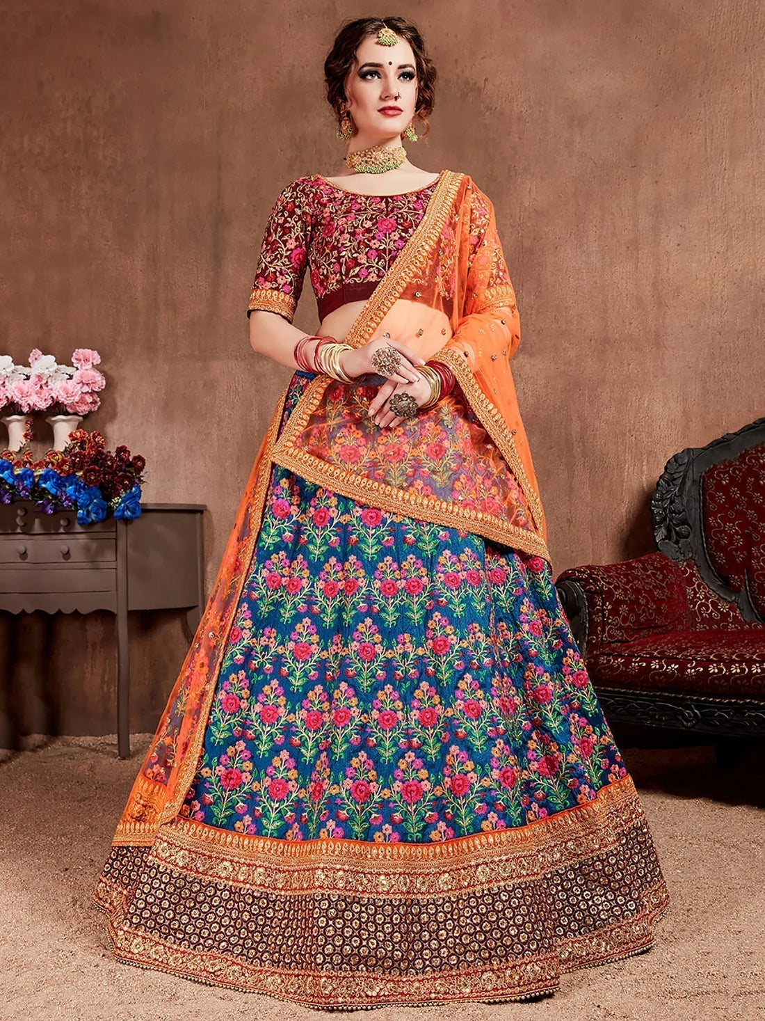 Flamboyant Blue-Red Colored Bridal wear Embroidered Lehenga Choli
