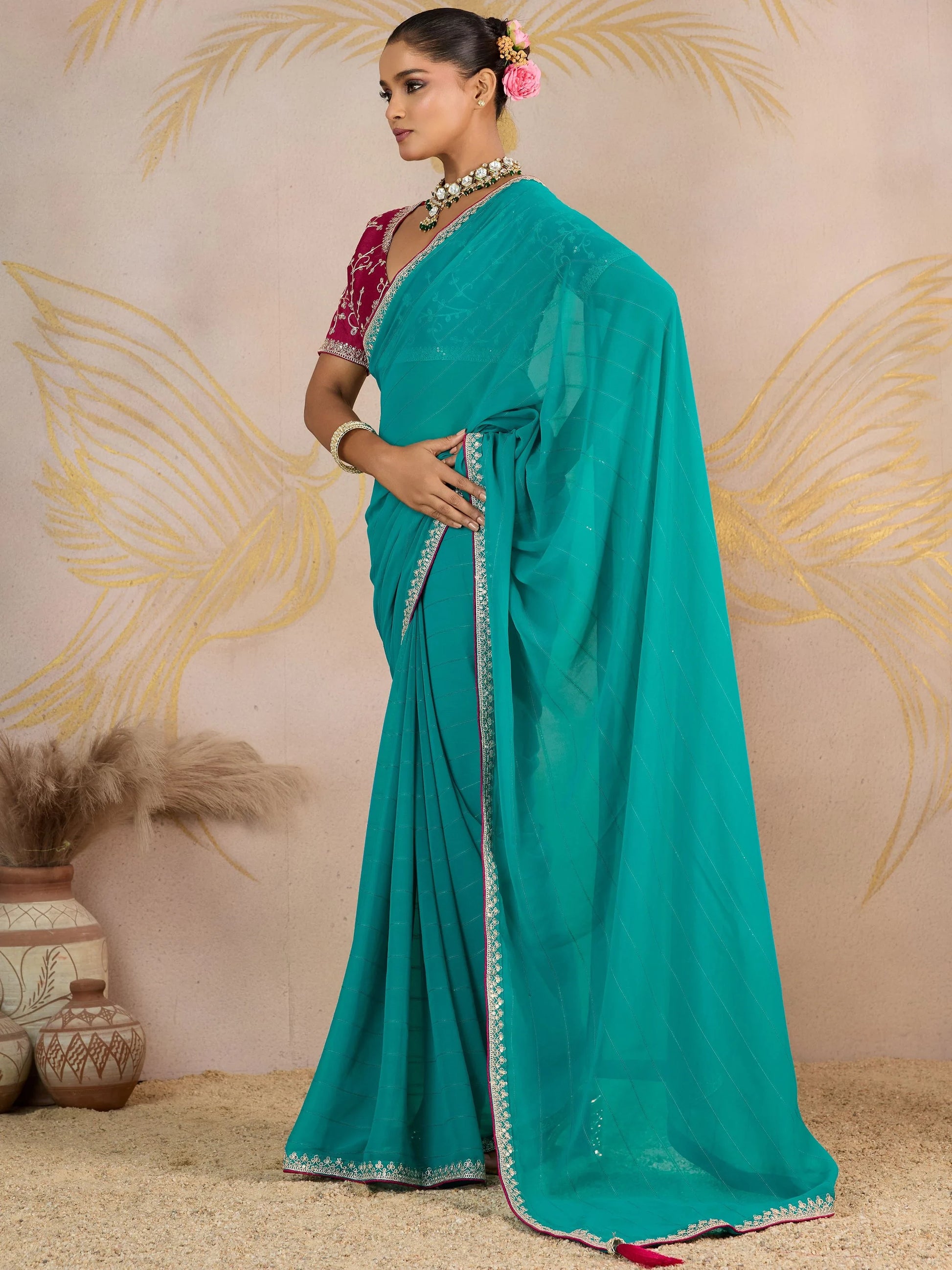 Glorious Turquoise Zari Border Work Georgette Traditional Saree With Blouse