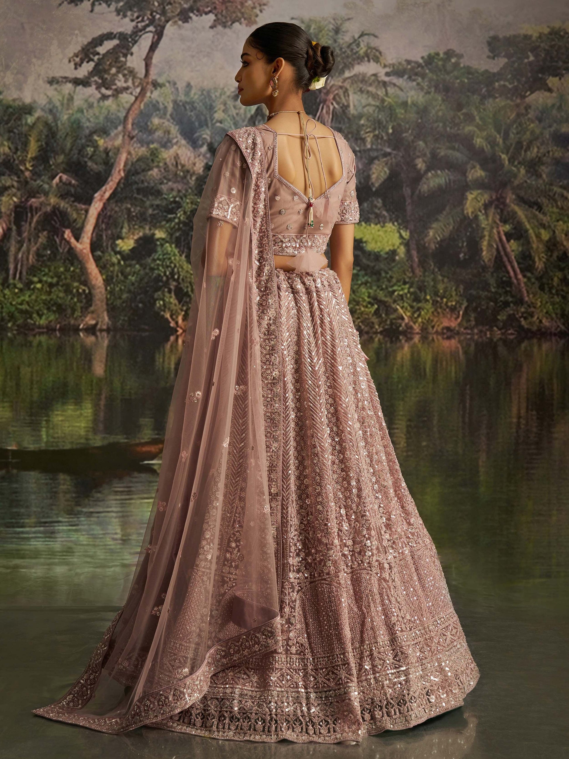 Gorgeous Mauve Sequins Net Reception Wear Lehenga Choli With Dupatta