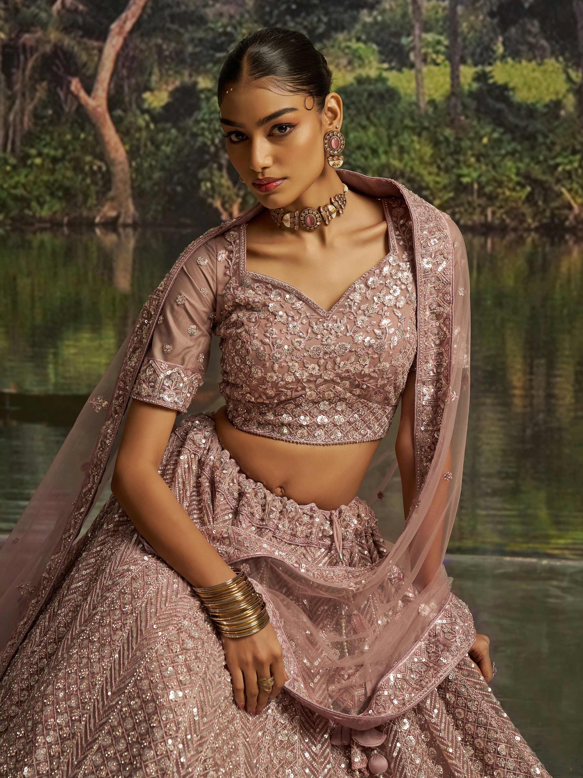 Gorgeous Mauve Sequins Net Reception Wear Lehenga Choli With Dupatta