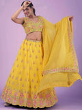 Yellow embroidered lehenga choli with floral motifs and dupatta, perfect for festive occasions