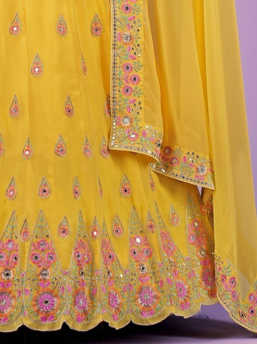 Yellow embroidered women's ethnic dress with floral mirror work and scalloped hem