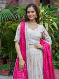 Graceful Off-White Heavy Work Silk Lehenga Choli With Pink Dupatta