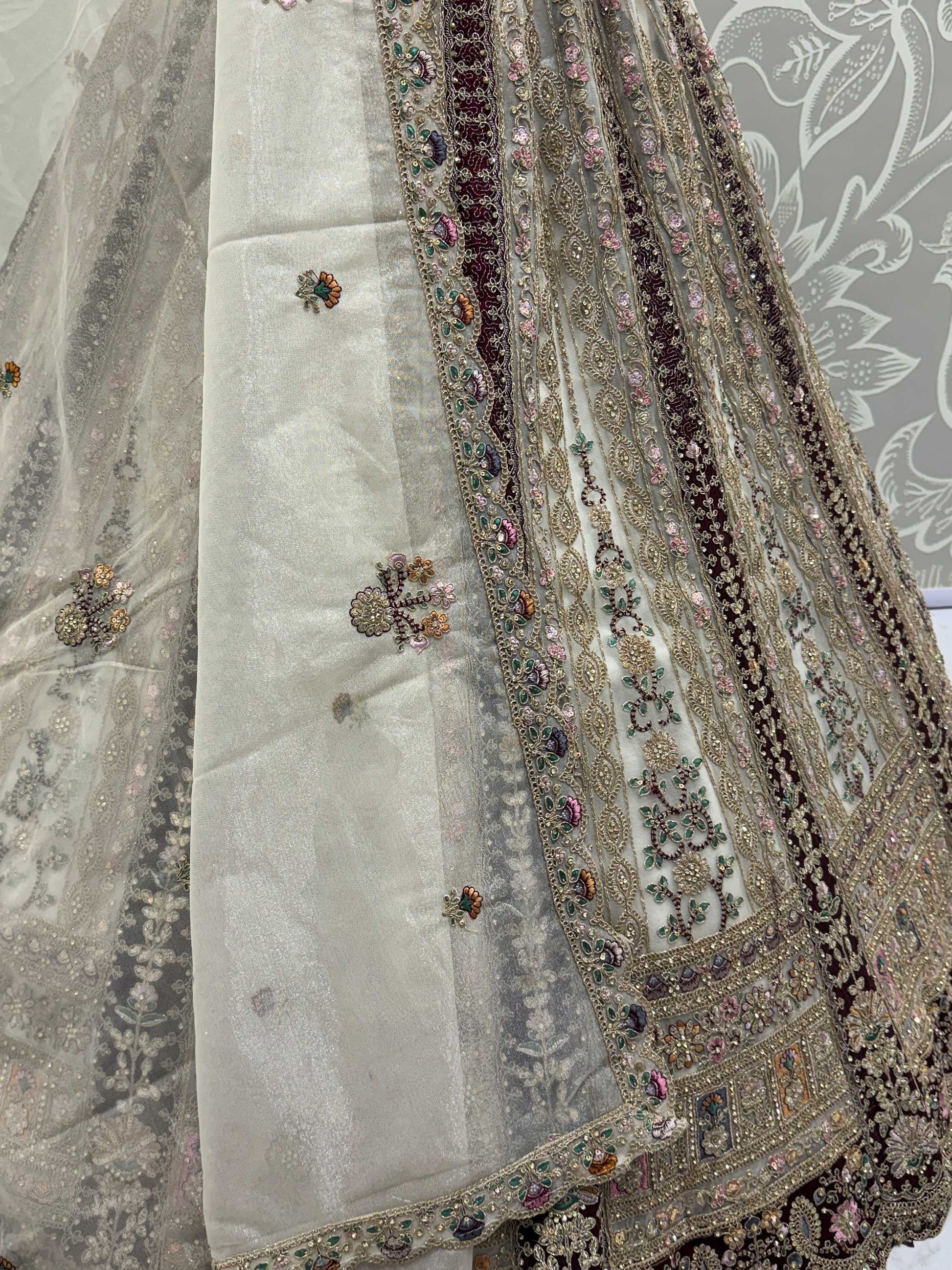 Great Off-White Stone Work Net Wedding Wear Lehenga Choli With Dupatta