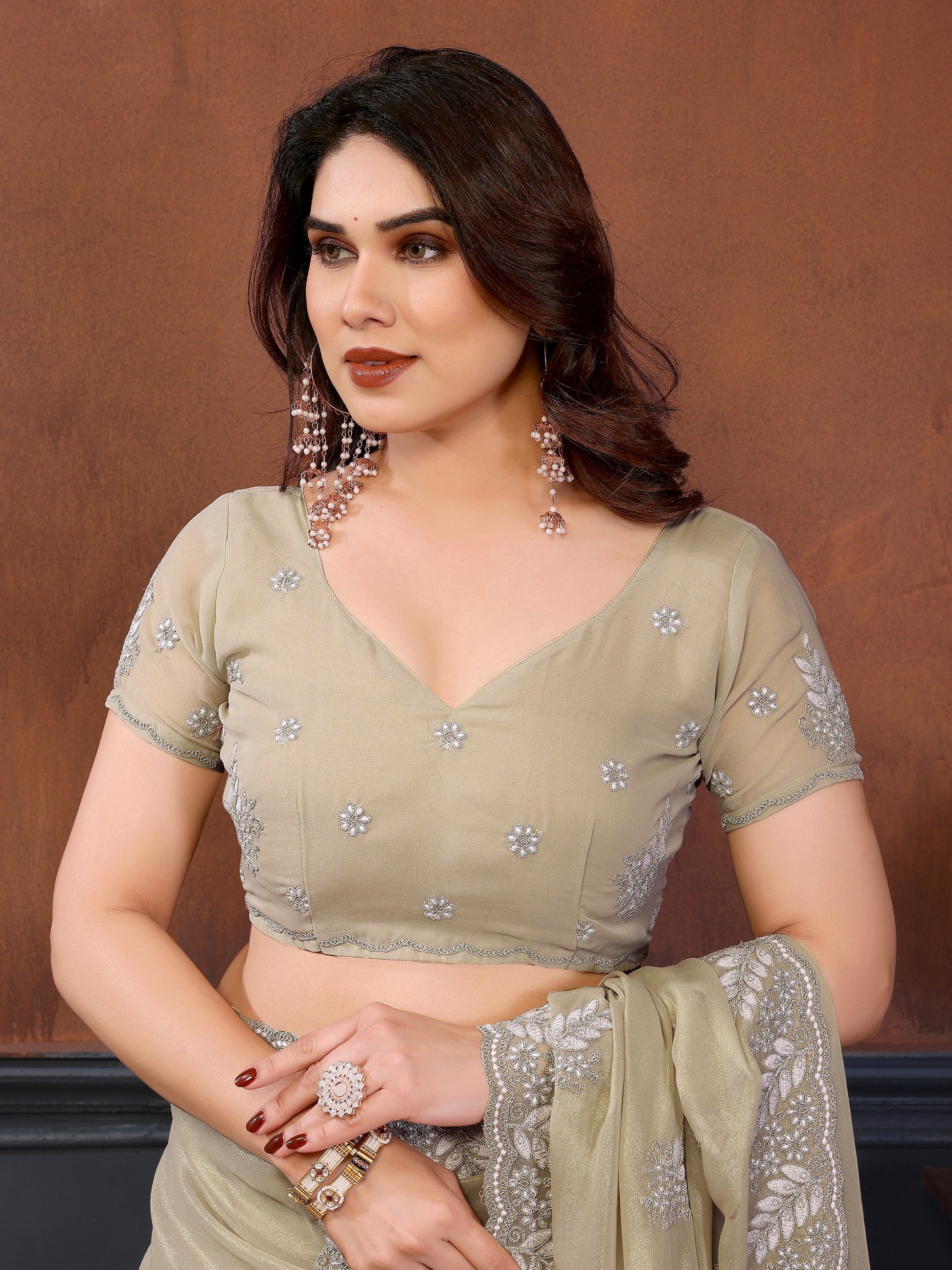 Excelled Ivory Embroidered Georgette Festive Wear Saree With Blouse