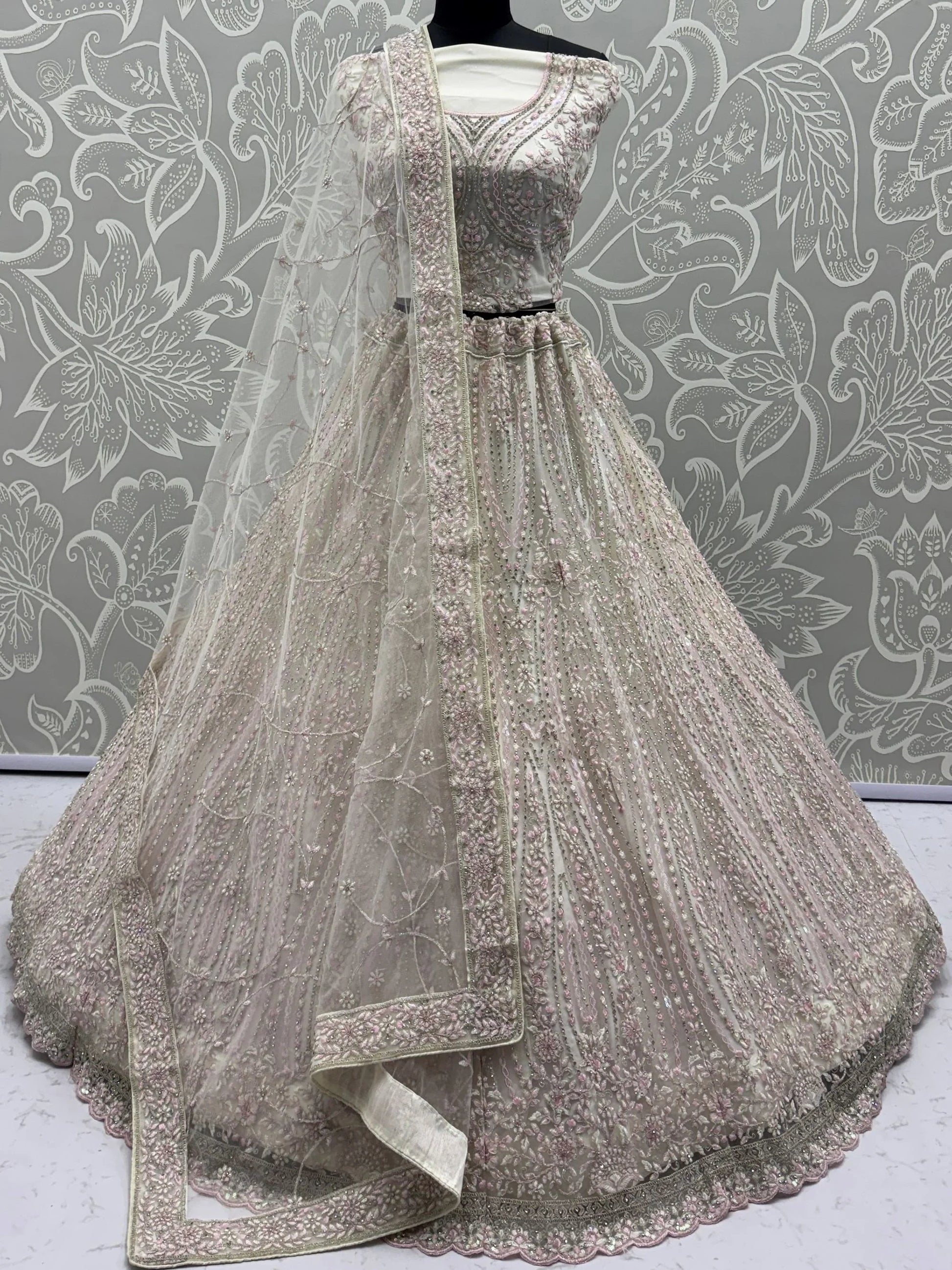 Impressive White Dori Embroidery Net Reception Wear Lehenga Choli