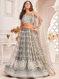 Elegant sage green lehenga with white floral embroidery, perfect for weddings and festive occasions.