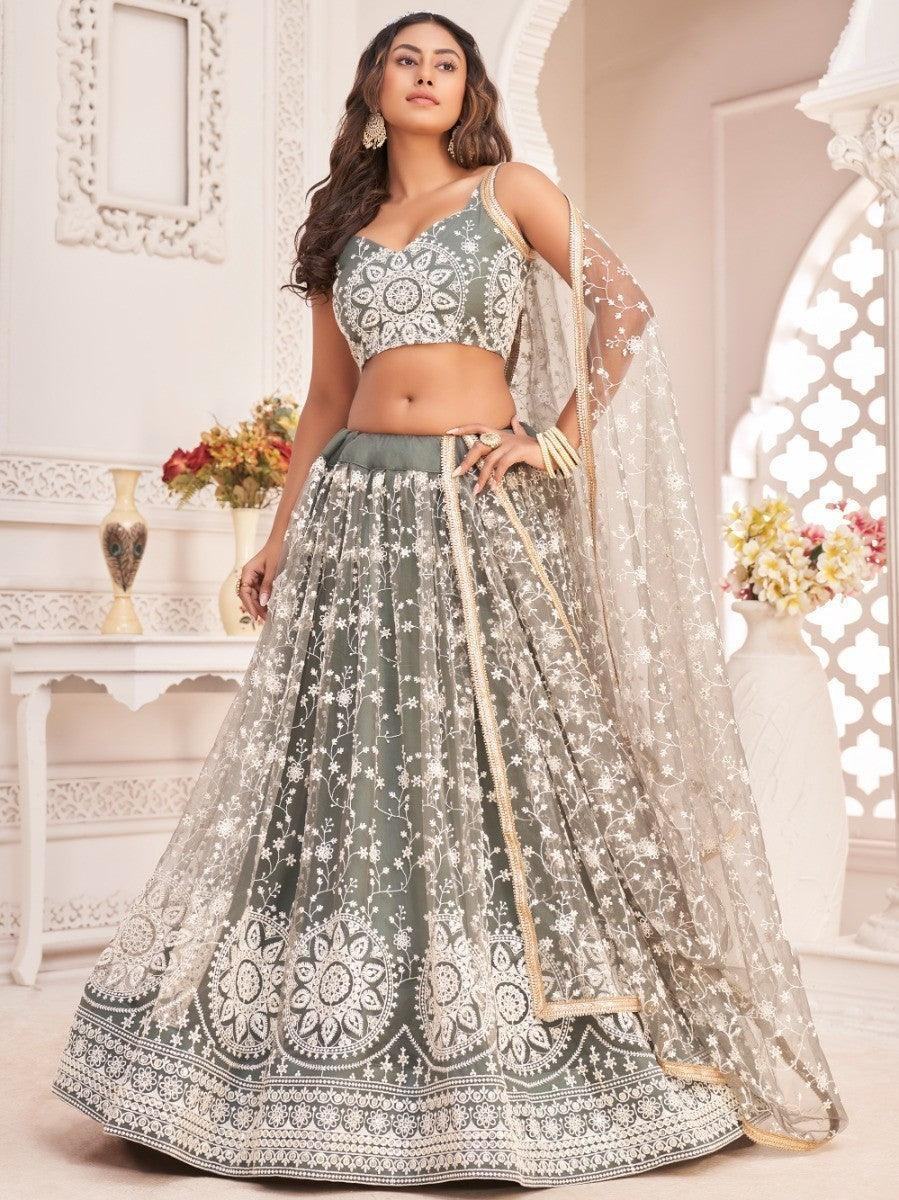 Elegant sage green lehenga with white floral embroidery, perfect for weddings and festive occasions.