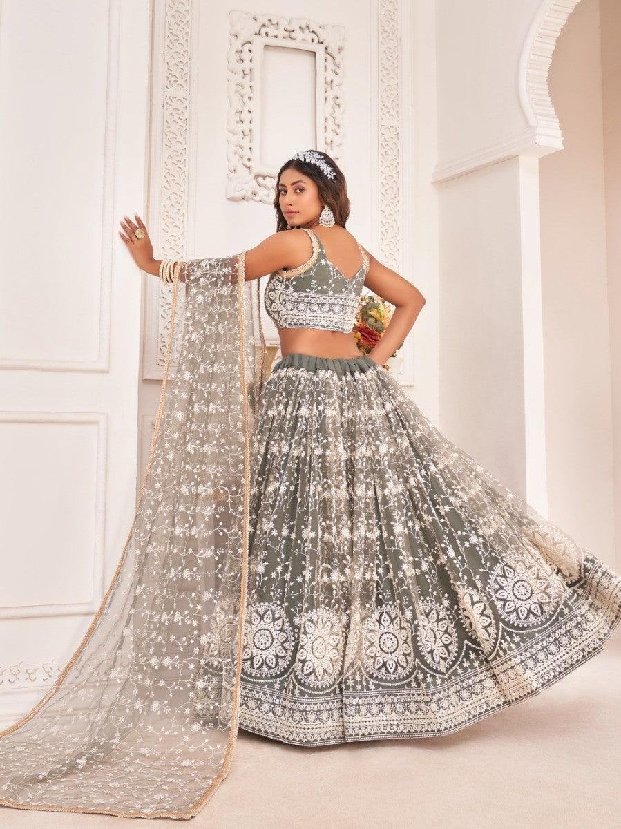 Elegant grey lehenga with white floral embroidery, perfect for weddings or festive occasions.