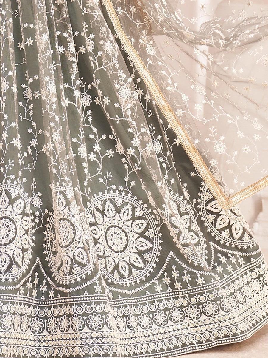 Olive green lehenga with white floral embroidery and gold trim, elegant traditional Indian wedding attire