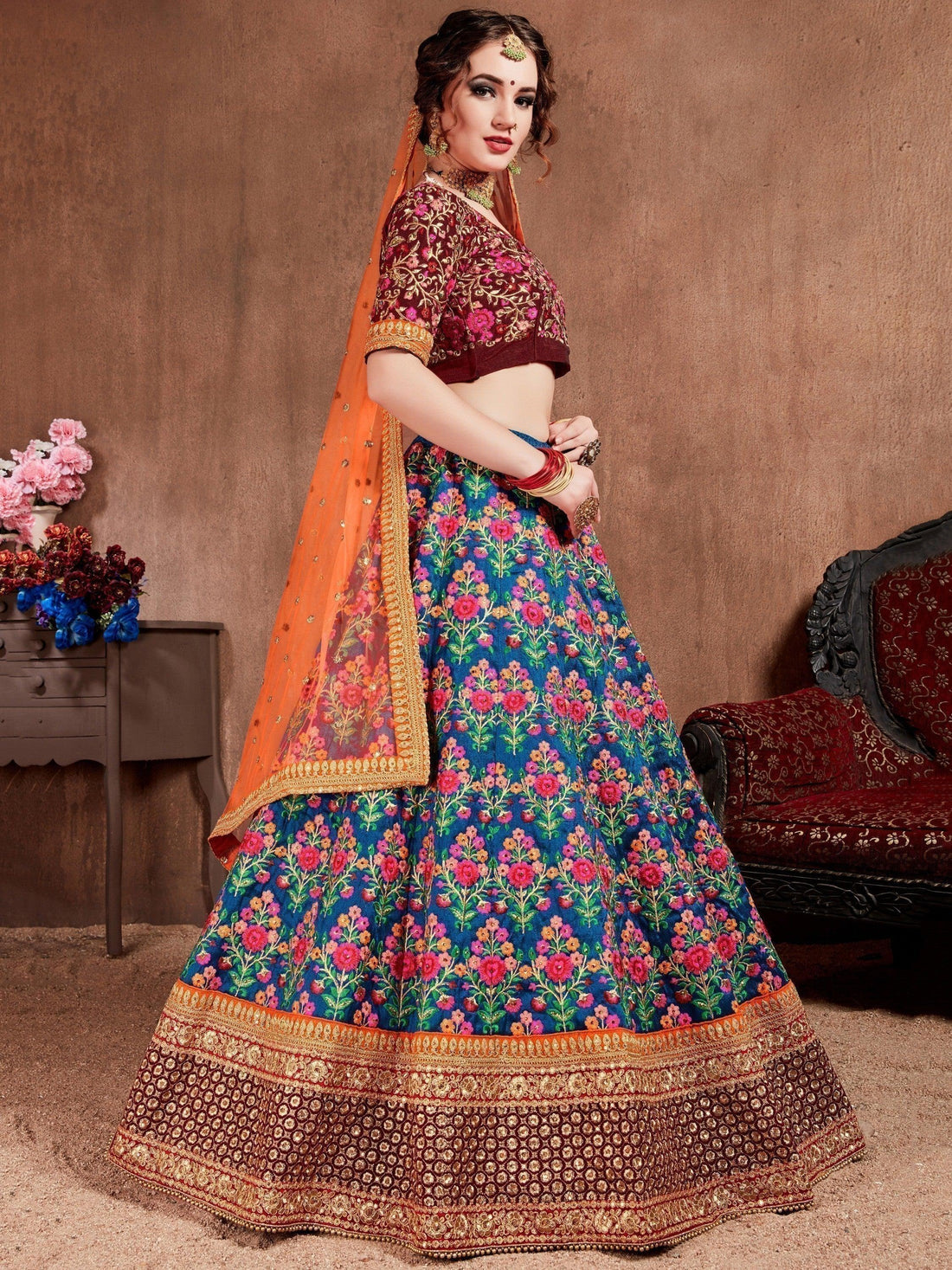 Intricate Blue Colored Bridal wear Embroidered Lehenga Choli