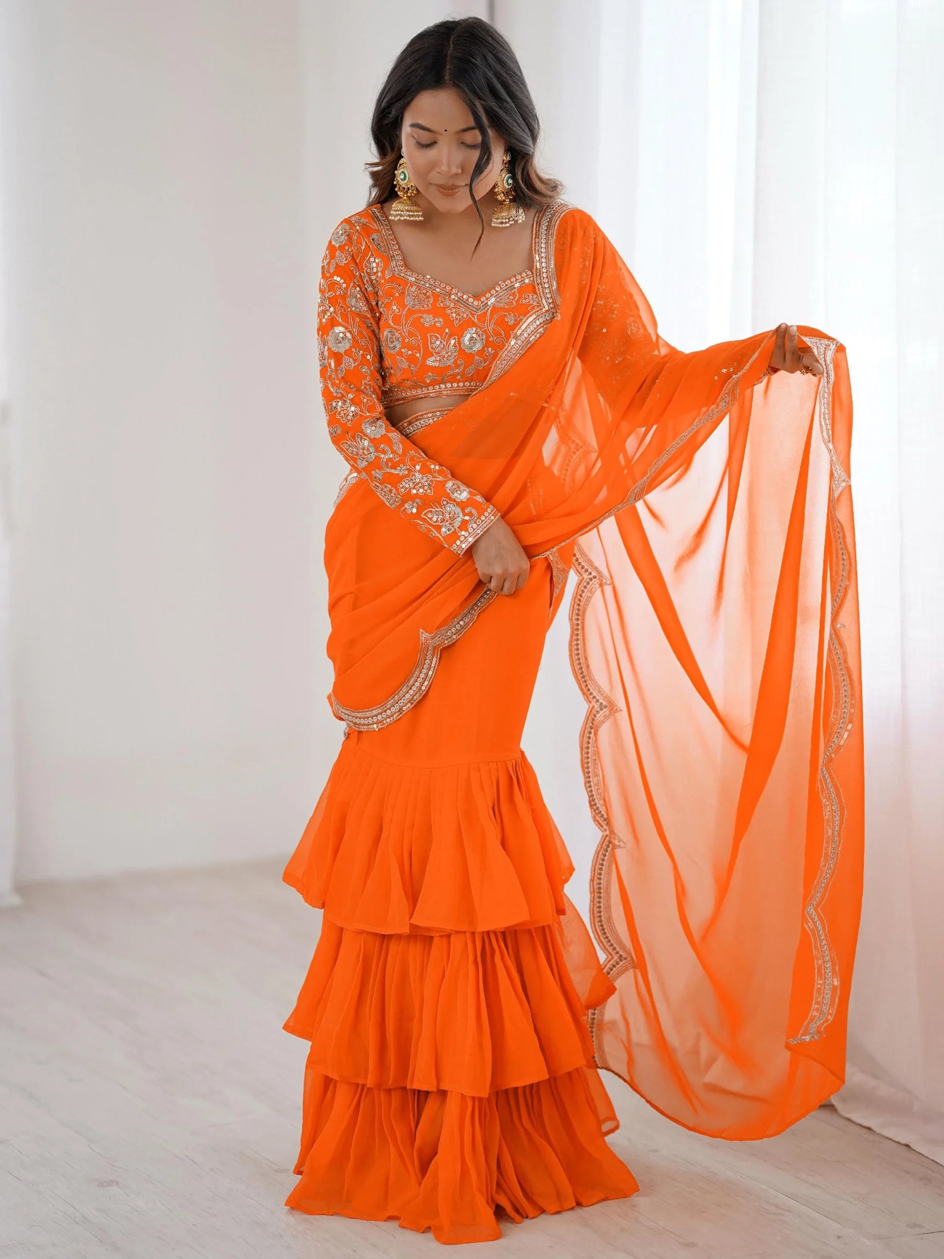 Lovely Orange Georgette Party Wear Ruffle Lehenga Saree With Embroidered Blouse