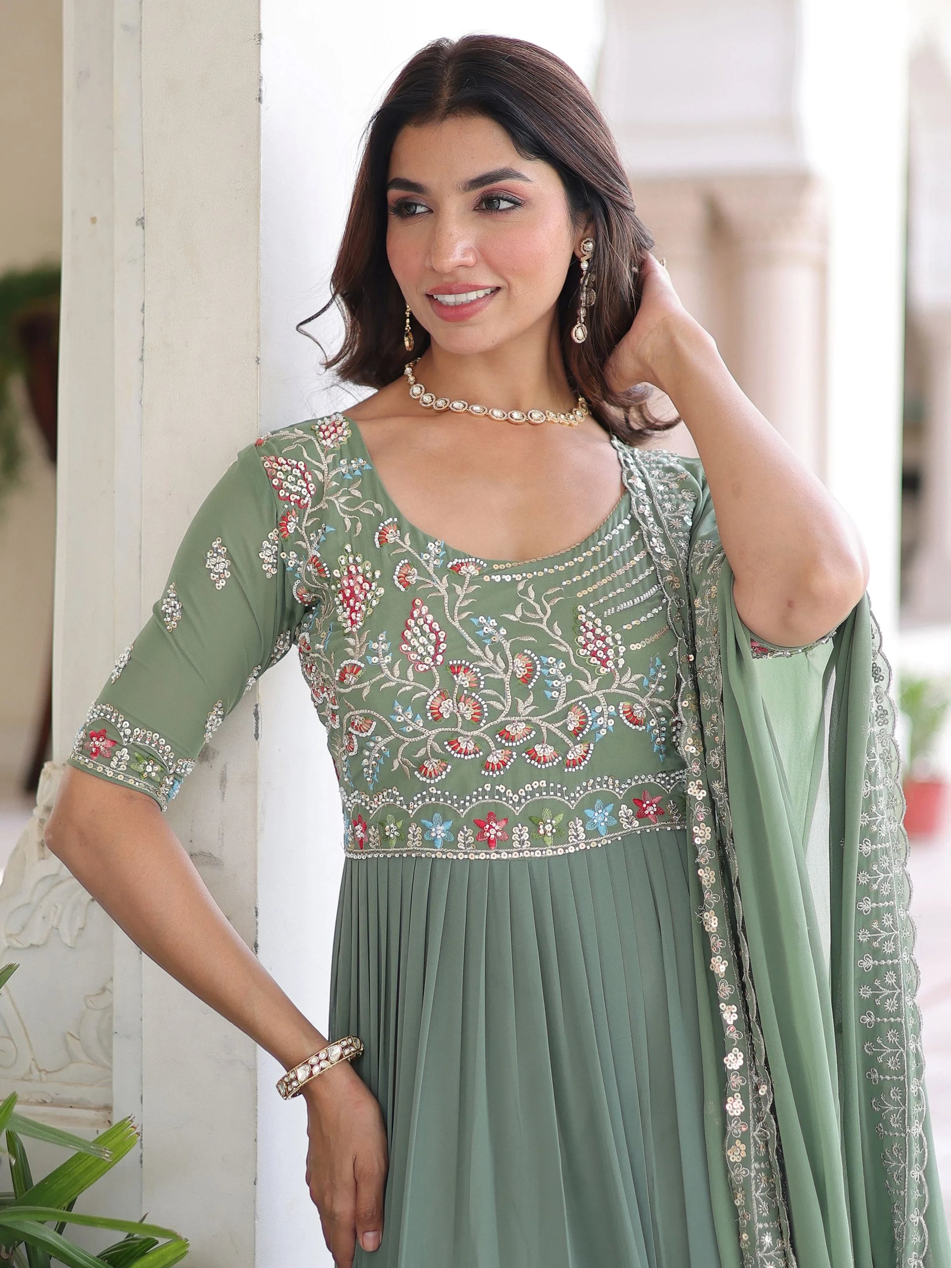 Lovely Pista Green Sequins Georgette Mehendi Wear Gown With Dupatta