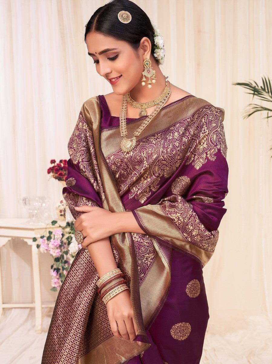 Elegant purple and gold saree with intricate paisley patterns, perfect for festive occasions