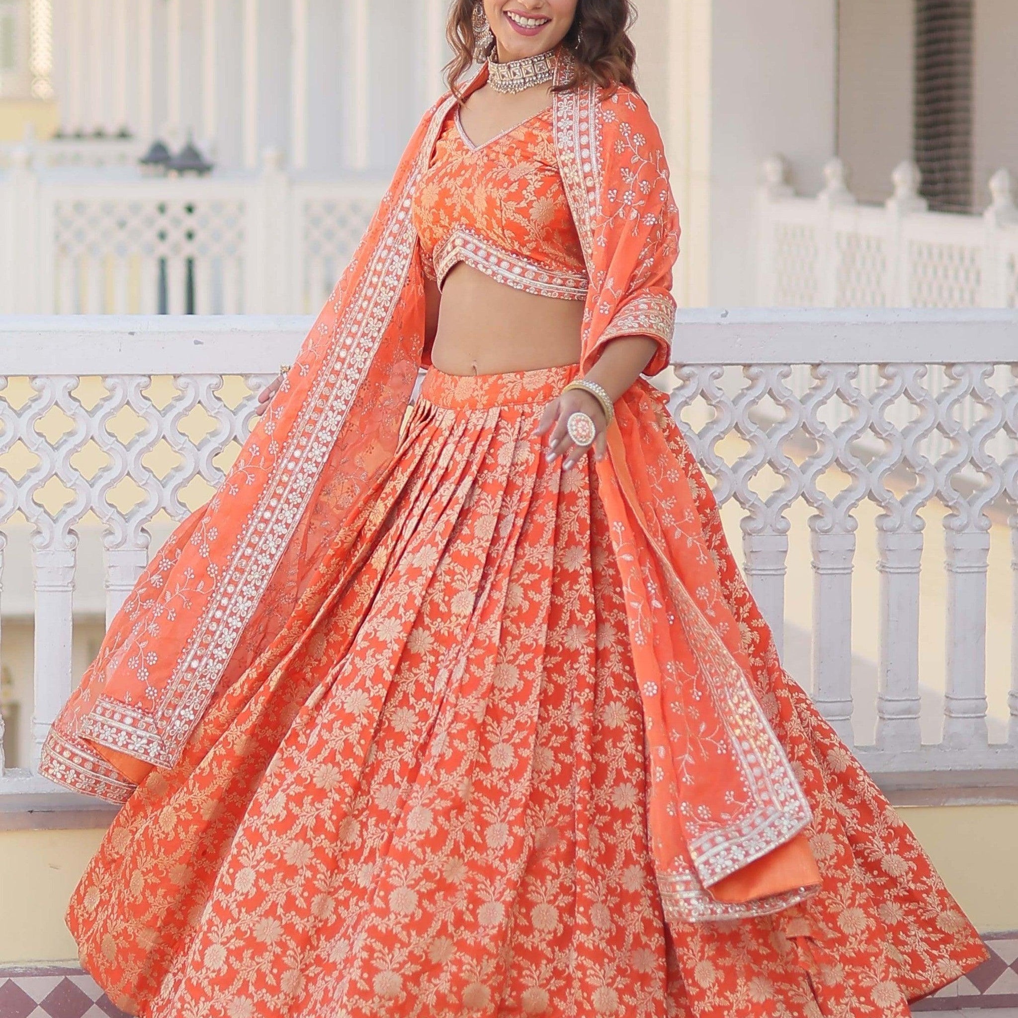Wonderful Orange Embroidered Jacquard Sangeet Wear Lehenga Choli