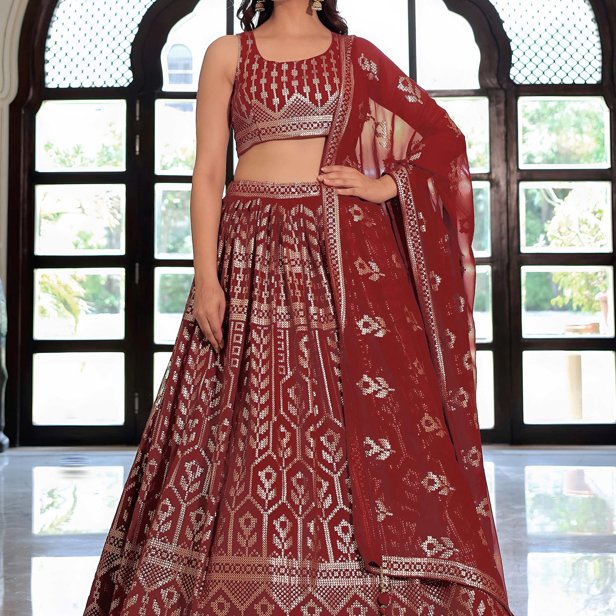 Noteworthy Maroon Sequins Georgette Reception Wear Lehenga Choli