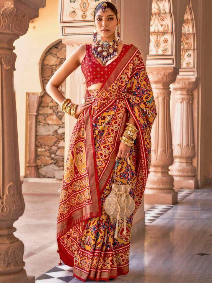Mesmerizing Mustard Yellow Patola Printed Silk Wedding Saree - Zeel Clothing