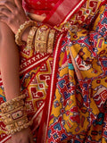Mesmerizing Mustard Yellow Patola Printed Silk Wedding Saree - Zeel Clothing