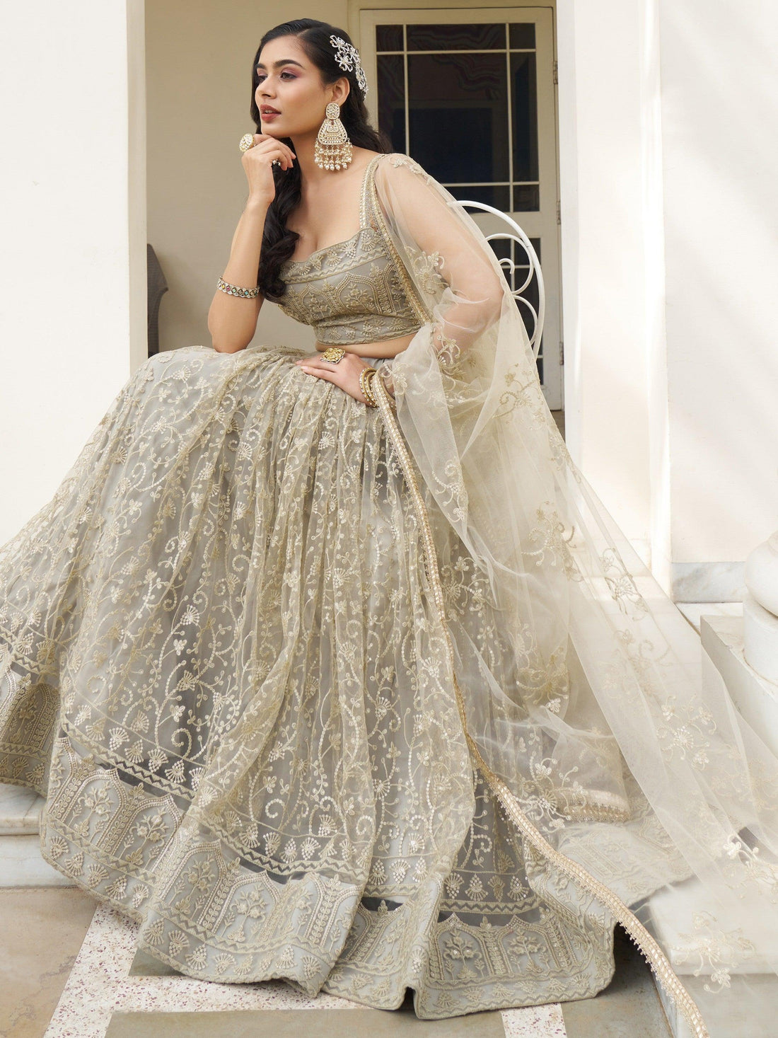 Bewitching Ivory Thread Work Net Engagement Wear Lehenga Choli
