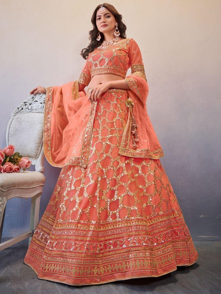 Wonderful Light Orange Sequins Work Net Lehenga Choli