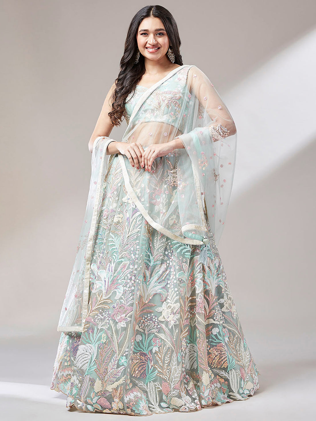 Astonishing Pista Green Sequins Net Wedding Wear Lehenga Choli