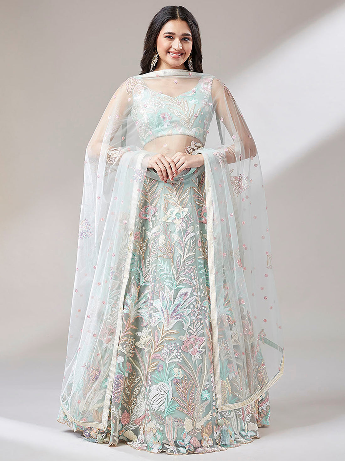 Astonishing Pista Green Sequins Net Wedding Wear Lehenga Choli