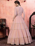 Elegant pink tiered gown with gold sequin detailing, perfect for women's fashion events