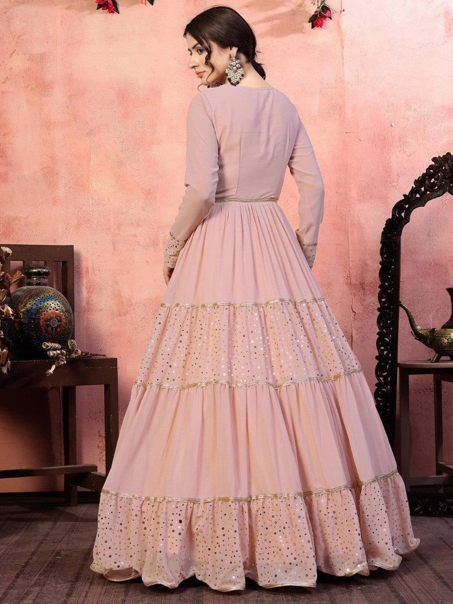 Elegant pink tiered gown with gold sequin detailing, perfect for women's fashion events