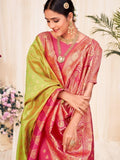 Woman in pink and green traditional saree with gold embroidery, elegant ethnic wear for women