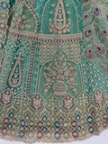 Pretty Sea Green Embroidered Net Function Wear Lehenga Choli With Dupatta