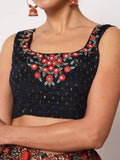 Black embroidered crop top with red floral design, sleeveless square neck, paired with matching earrings