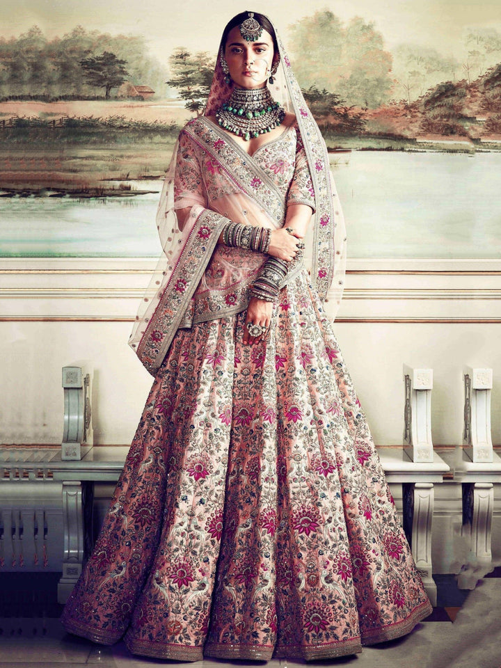 Prominent peach Colored Bridal wear Embroidered Lehenga Choli