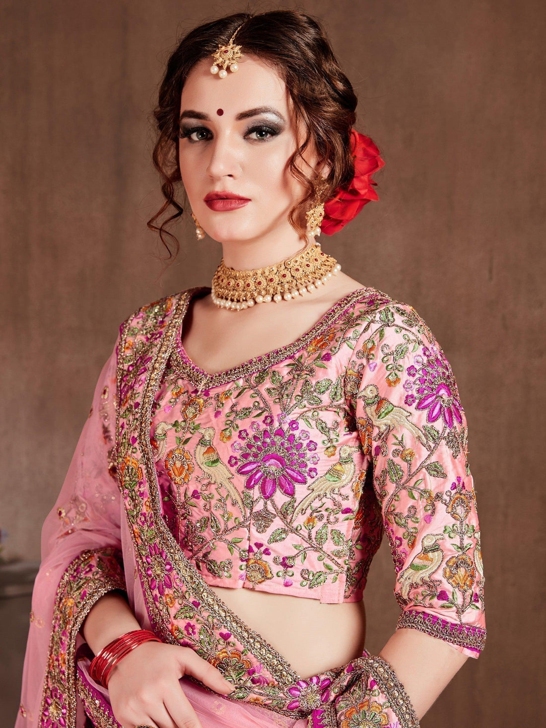 Prominent peach Colored Bridal wear Embroidered Lehenga Choli