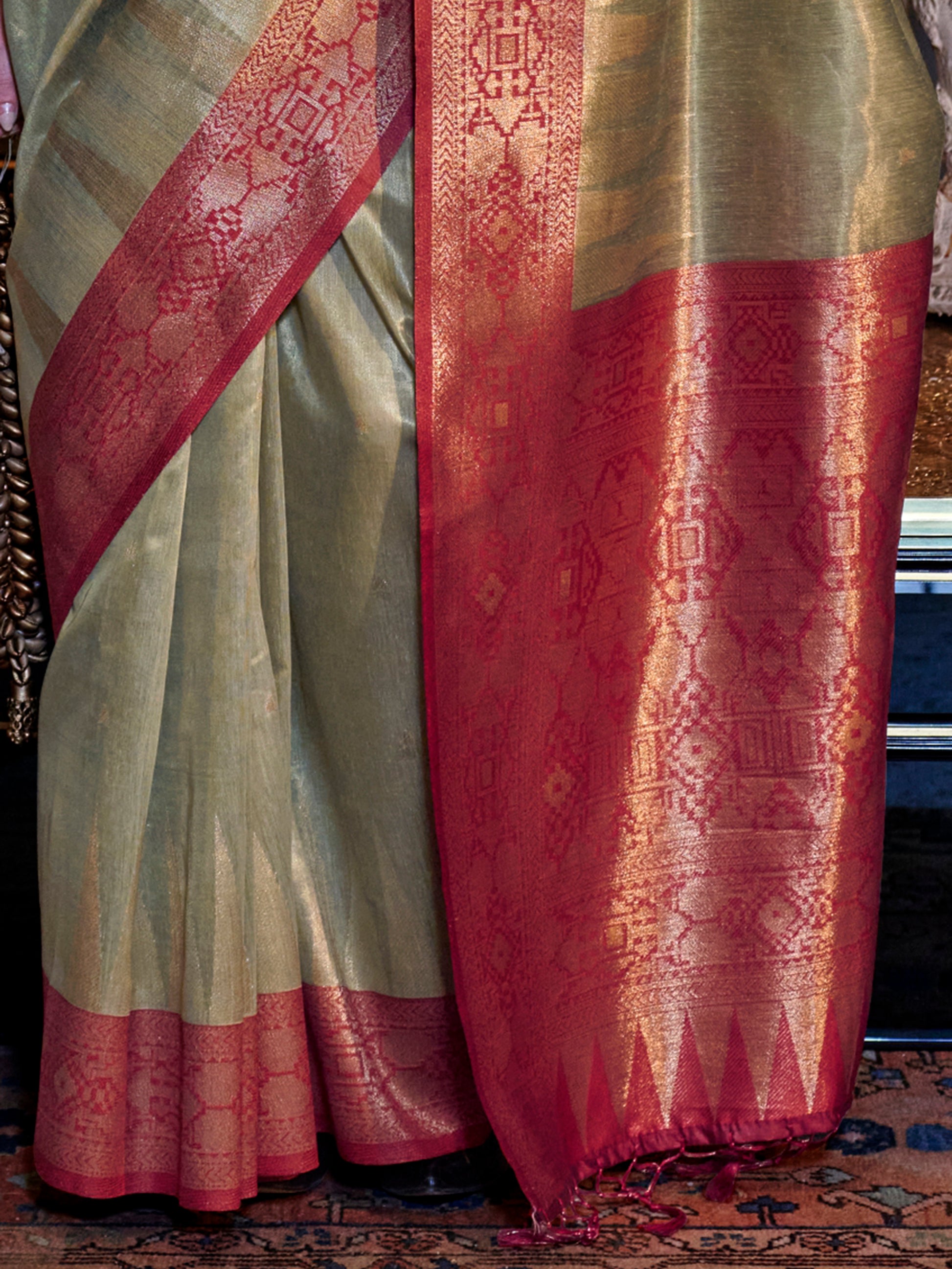 Fabulous Olive Green Zari Weaving Tissue Silk Event Wear Saree