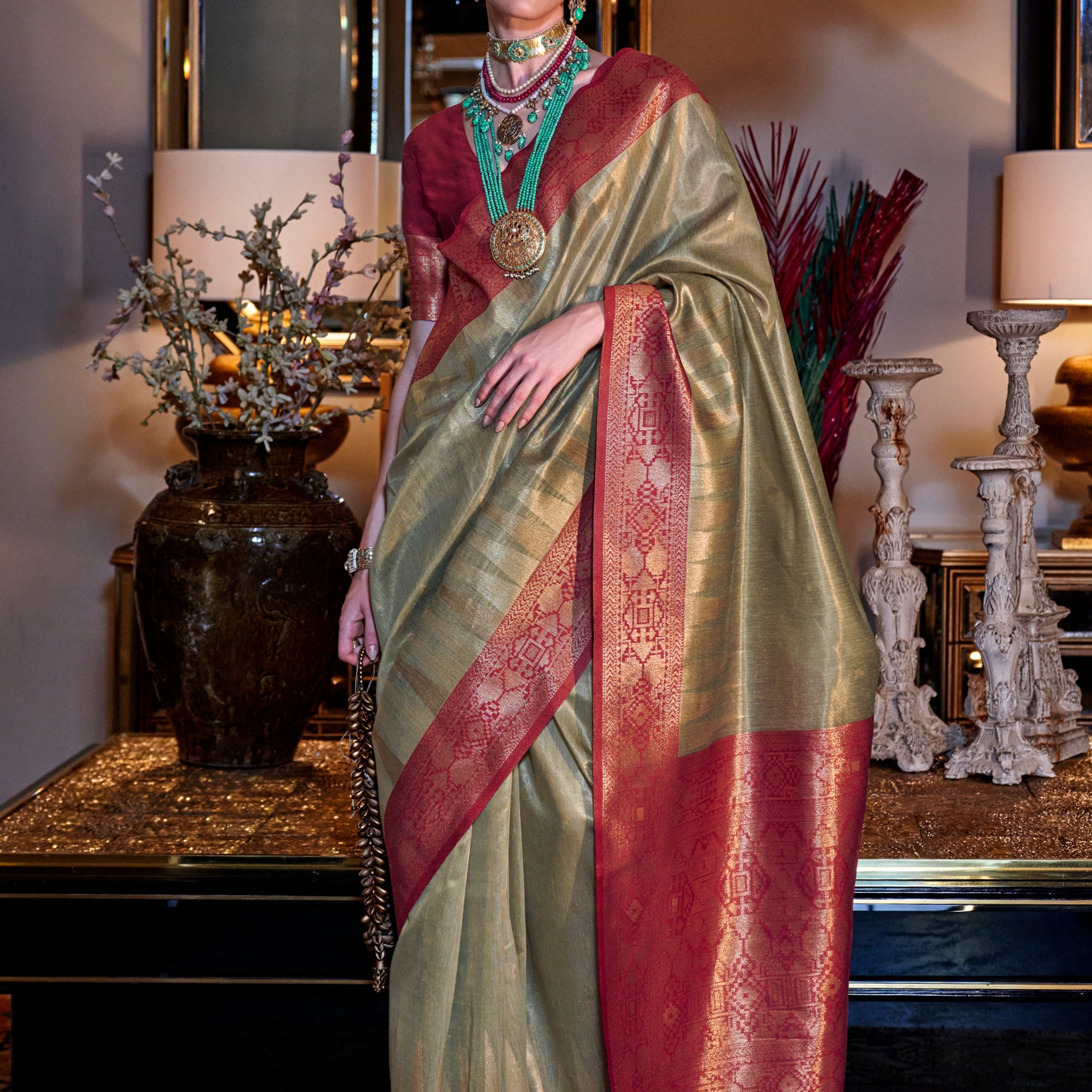 Fabulous Olive Green Zari Weaving Tissue Silk Event Wear Saree