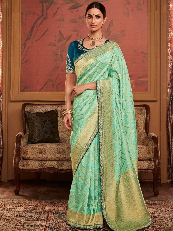 Ravishing Pista Green Zari Weaving Silk Reception Wear Saree