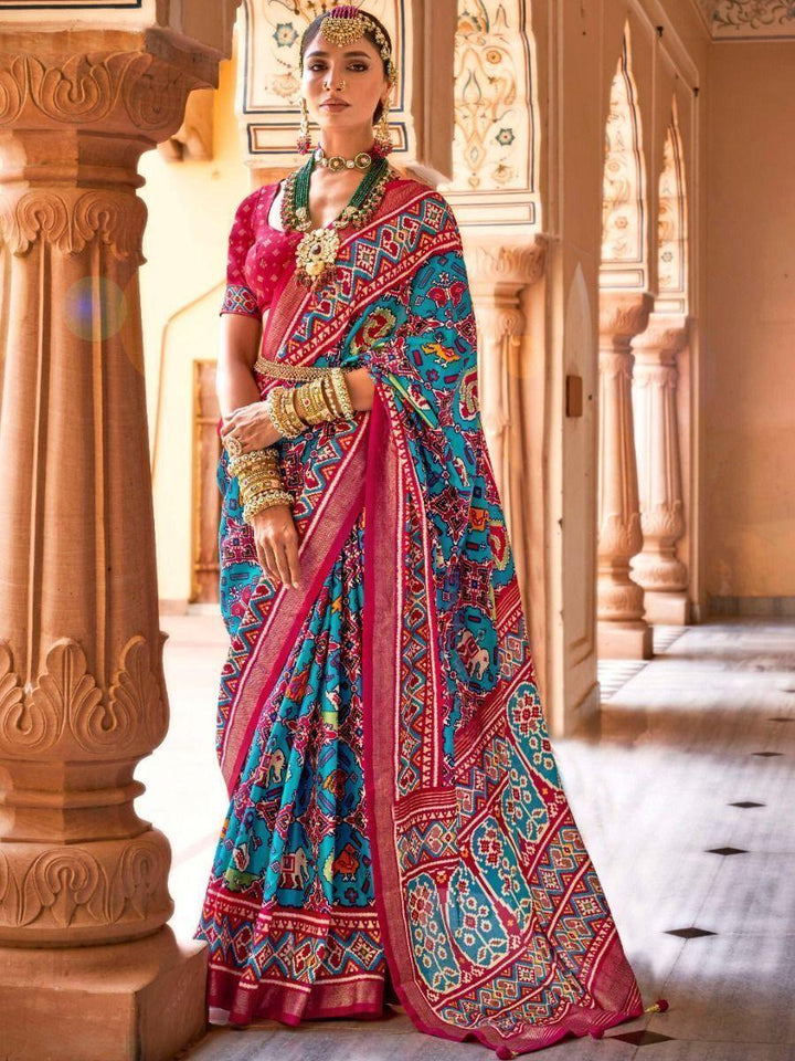 Tantalizing Sky-Blue Patola Printed Silk Wedding Wear Saree