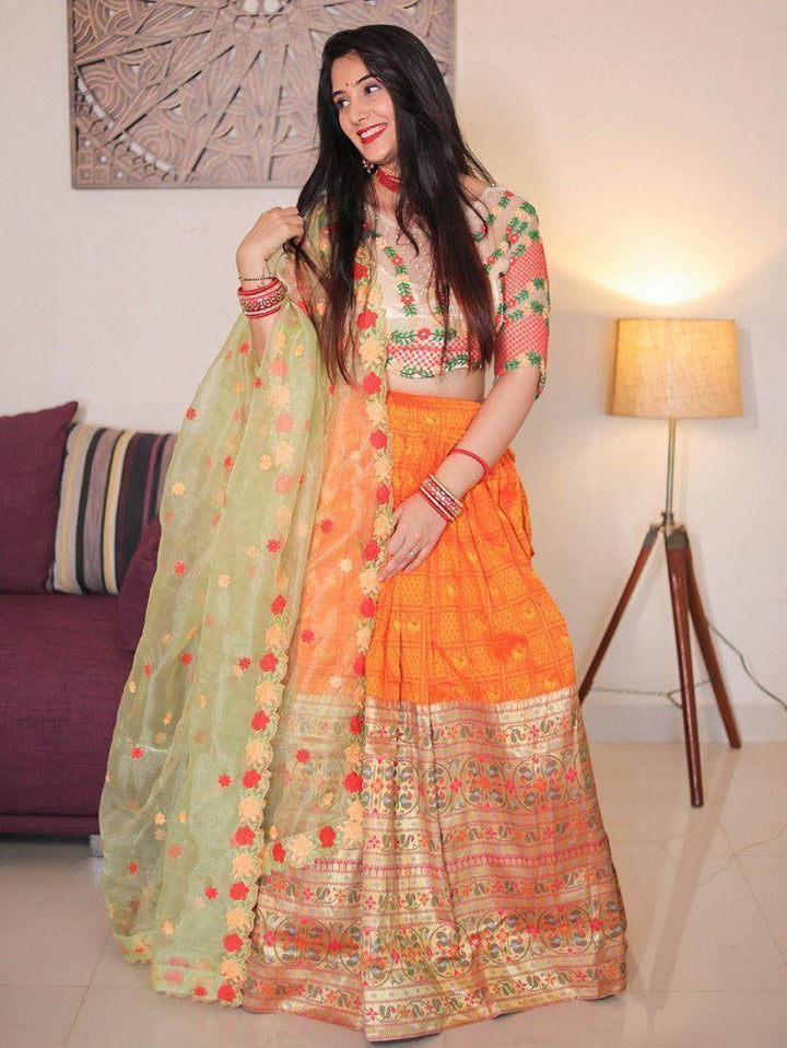 Standard Orange Weaving Silk Pathani Lehenga With Embroidered Choli - Zeel Clothing